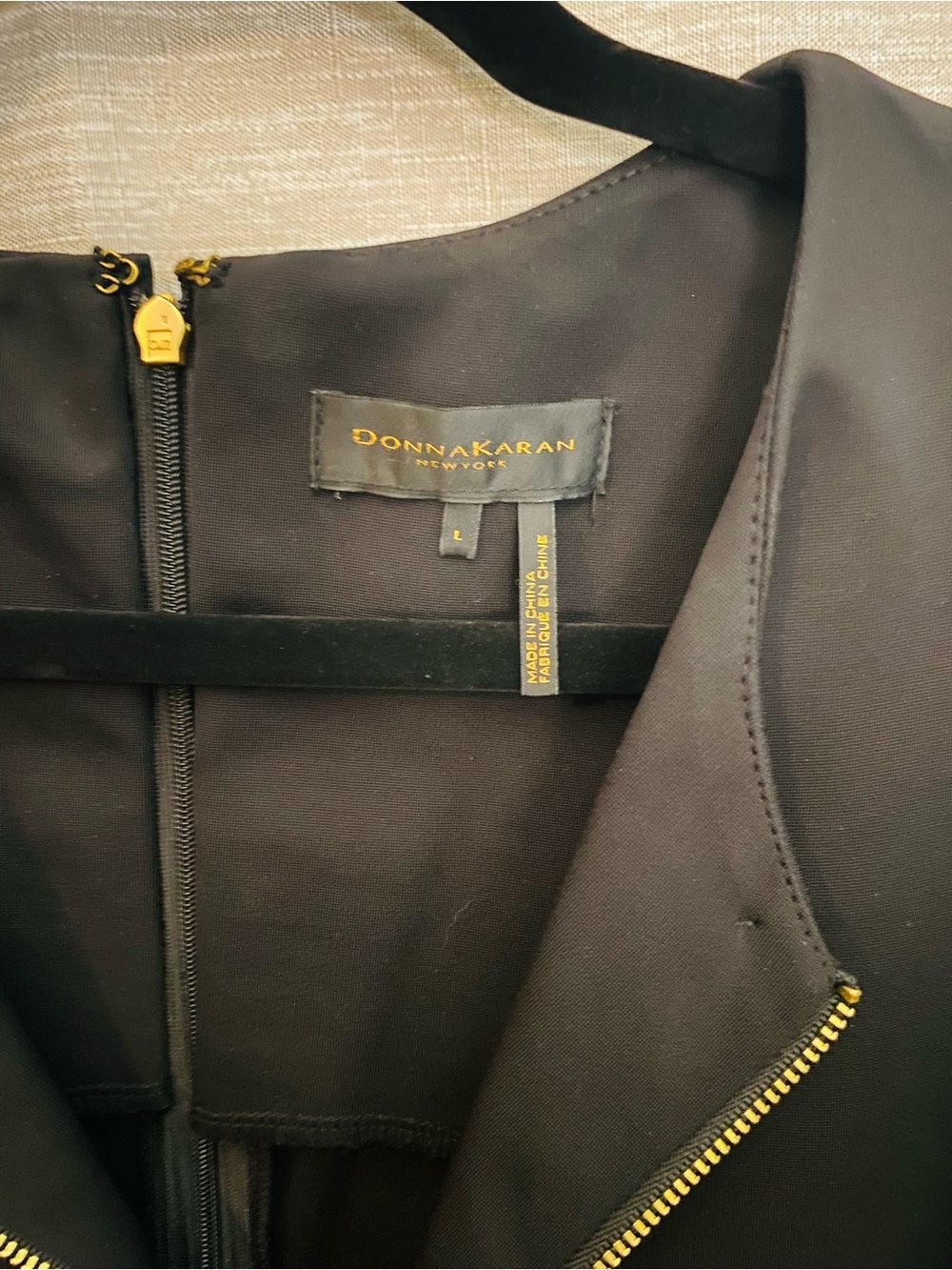 Donna Karan Black À-Line elegant dress with gold accent zippers with pockets.